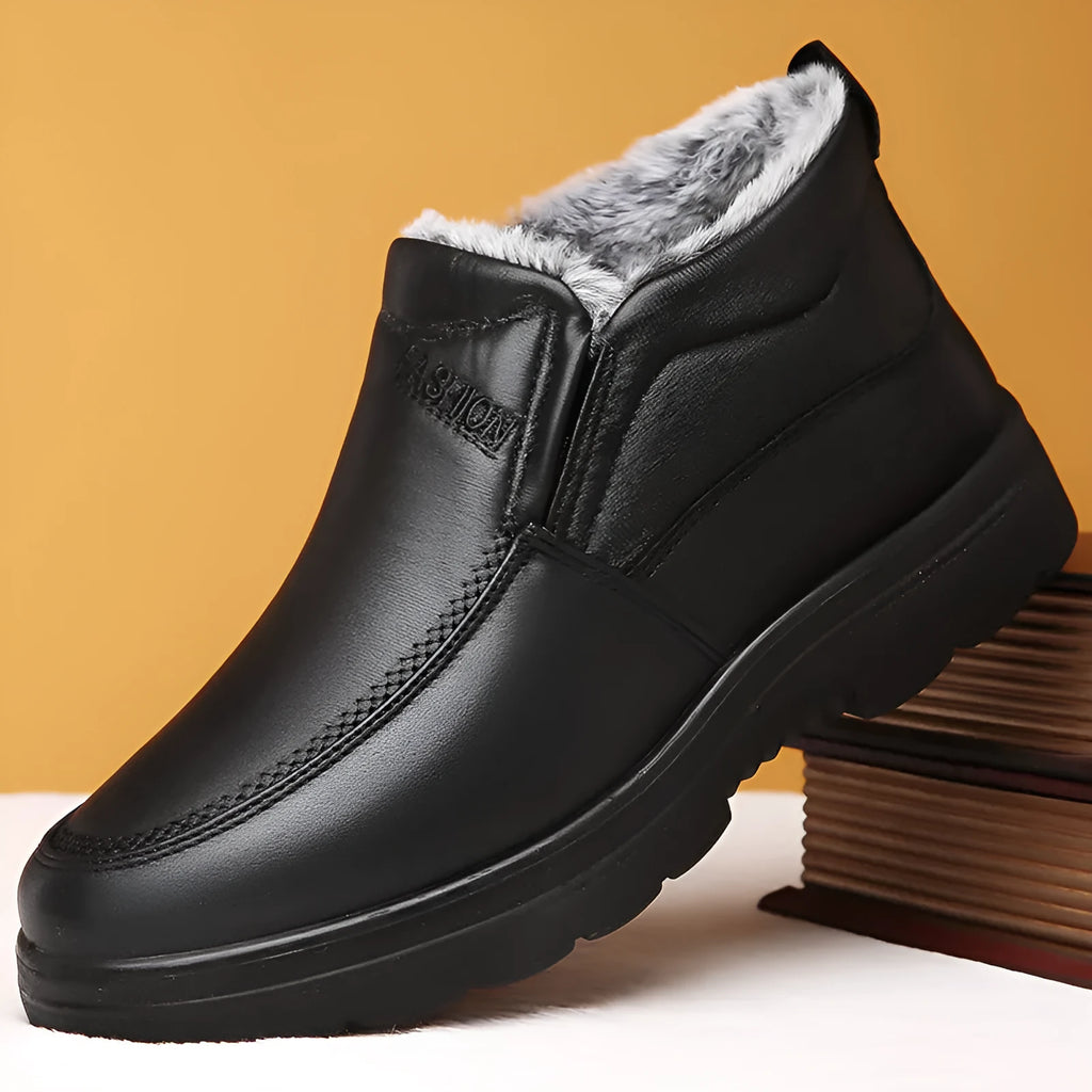 Men's black casual winter slip-on shoes with a waterproof PU upper and thick rubber sole.