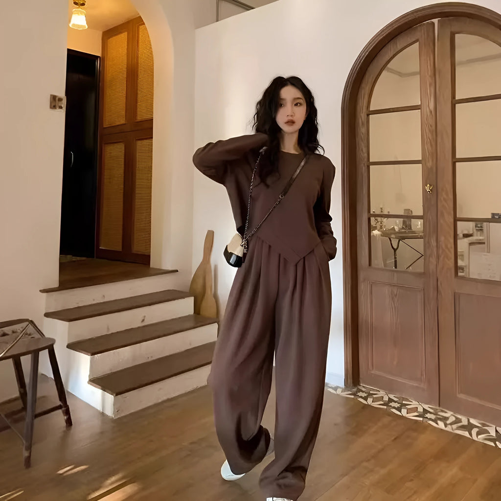 Brown women's loose fit casual sports suit set with long sleeve top and trousers on a model.