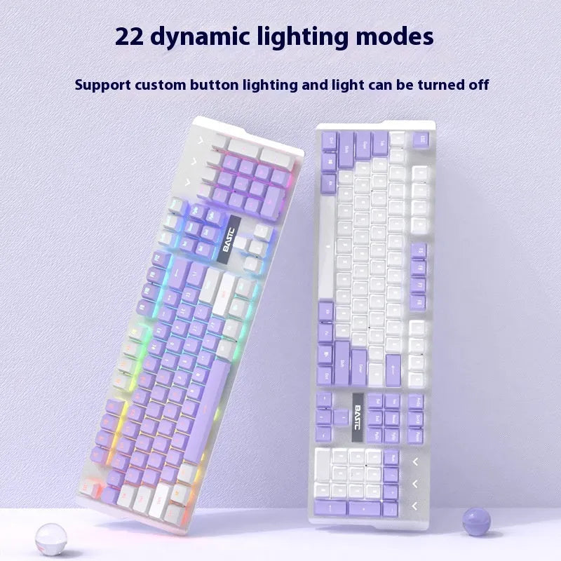 Purple mechanical keyboard and white mouse set with backlighting on wooden desk