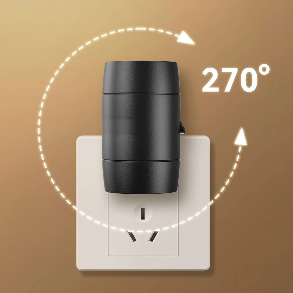 Small white plug-in night light with adjustable dial and rotatable head shown in a UK power socket.