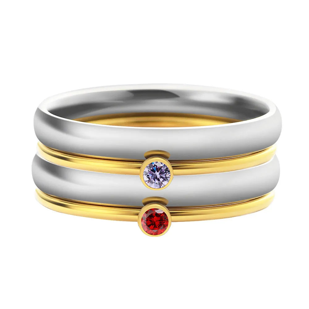 Geometric engraved titanium steel ring with December birthstone colour and gold tone electroplated handle.