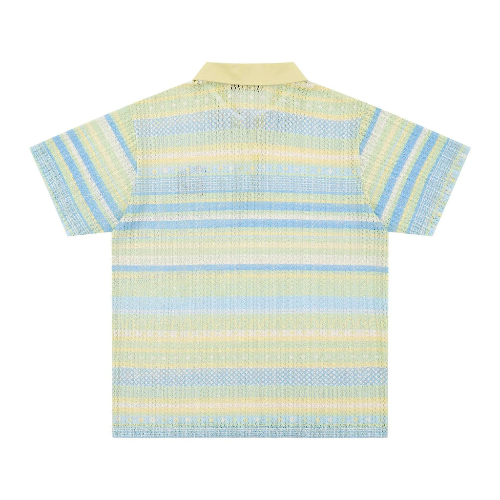 Man wearing a blue loose-fit printed casual shirt with short sleeves.