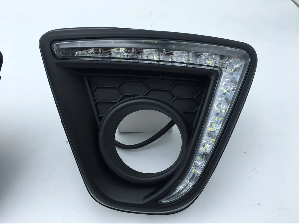 Pair of electroplated Mazda CX-5 daytime running light LED bulbs on a white background.