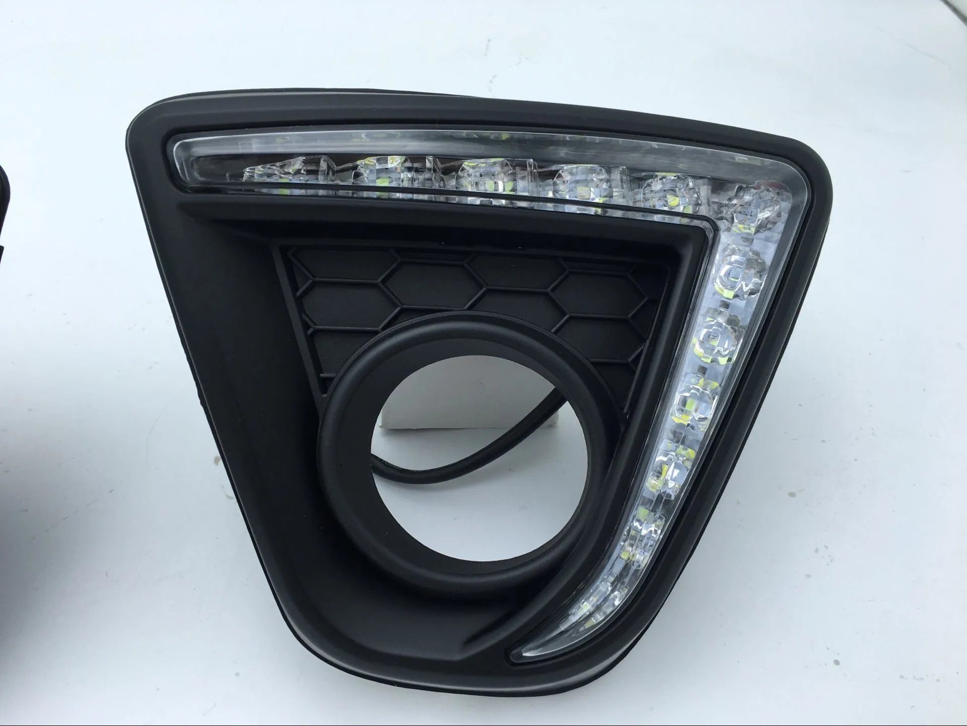 Pair of electroplated Mazda CX-5 daytime running light LED bulbs on a white background.