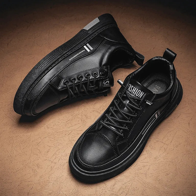 Men's black and white low-top skate shoes with elastic band fastening and rubber sole.