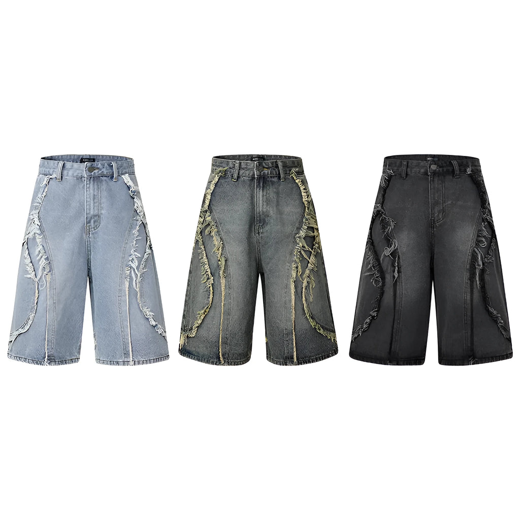 Distressed raw edge denim shorts in a straight-leg cropped fit on a hanger.