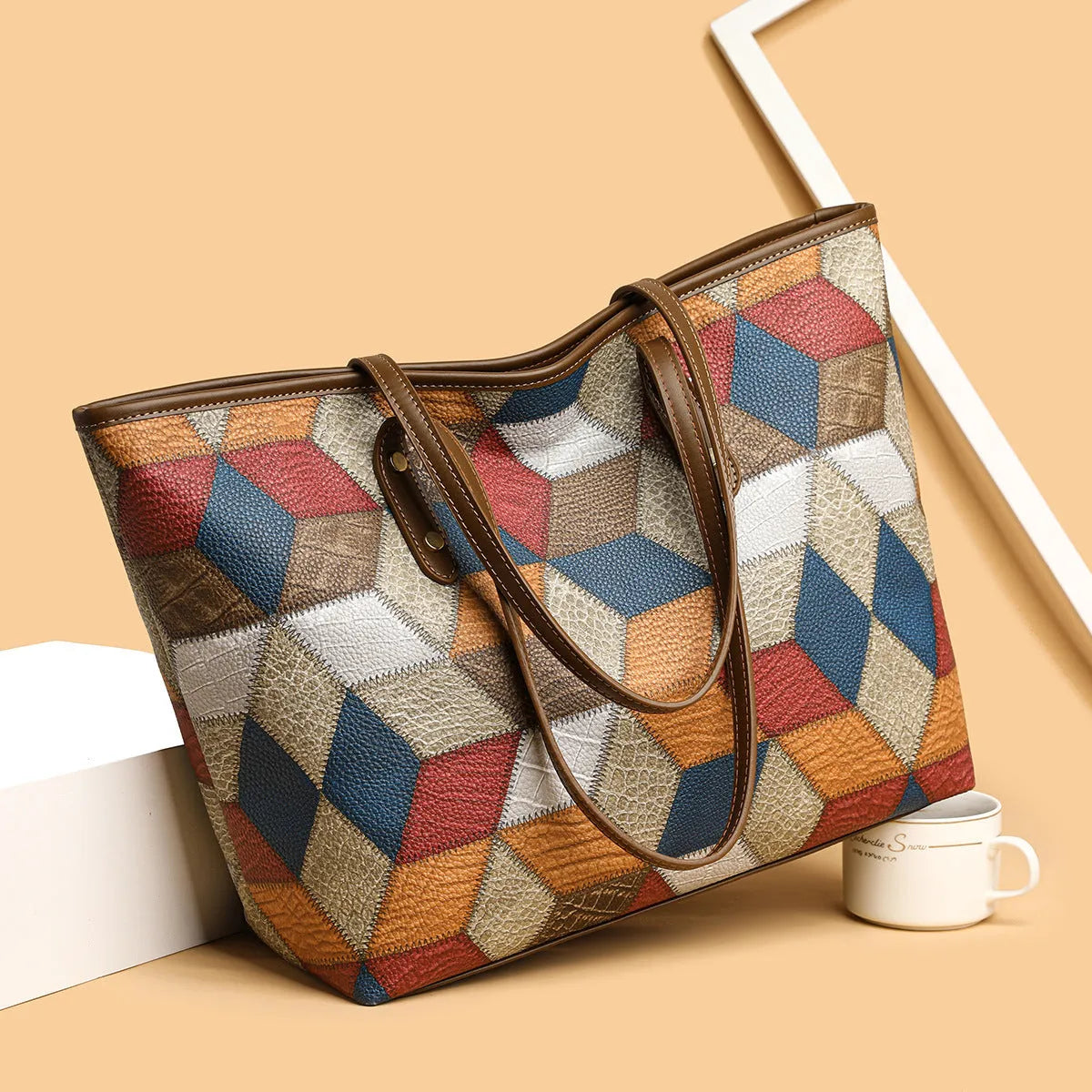 Women's blue brown PVC shoulder bag with sandwich pocket design showing interior organisation
