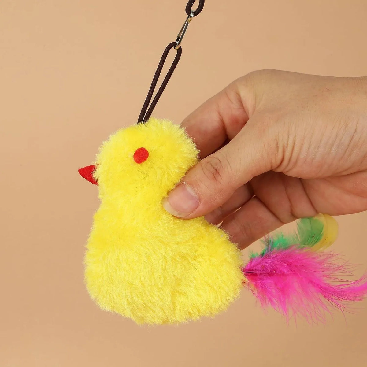 Interactive cat toy hanging on door frame with elastic rope, dangling mouse toy, and treat reward bulb