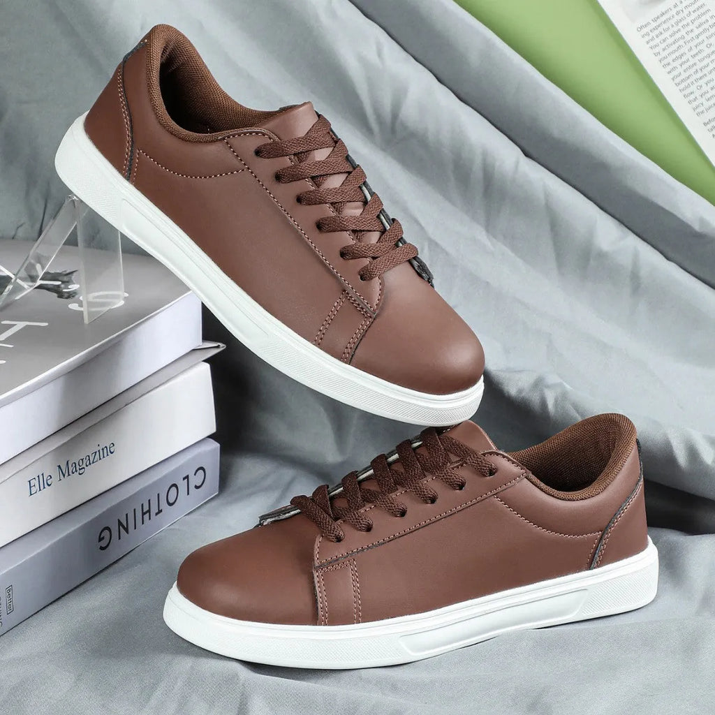 Women's platform skateboard sneakers with cross-strap detailing and mid-heel sole