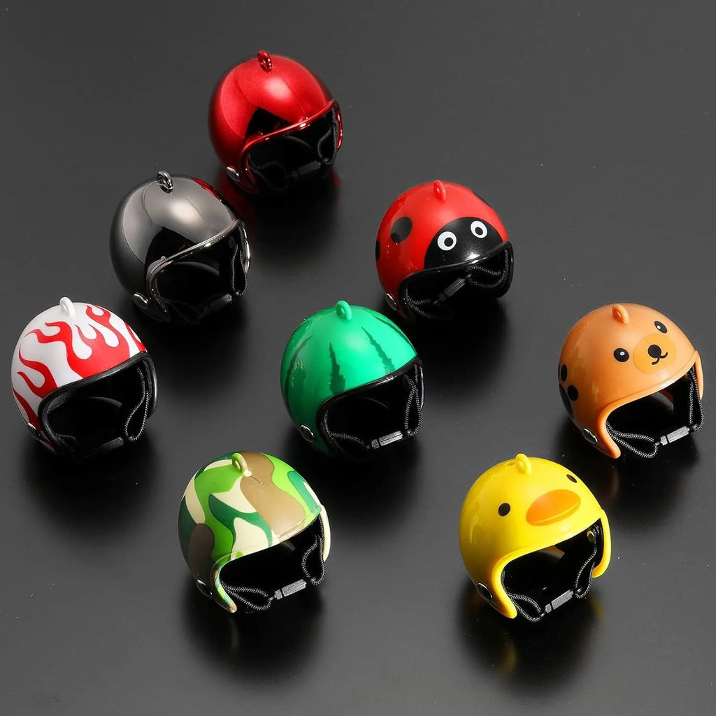 Small hard plastic helmet for chicken or bird with elastic straps and sponge lining.