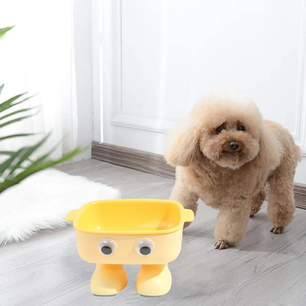Green cartoon robot shaped elevated cat bowl with tilted food dish on anti-slip base