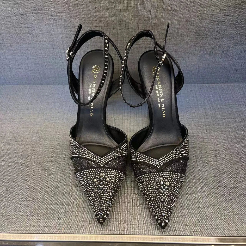 Women's black hollow high heels with red sole and pointed toe stiletto design