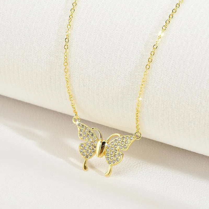 Gold titanium steel twisted chain clavicle necklace with magnetic butterfly snap closure.