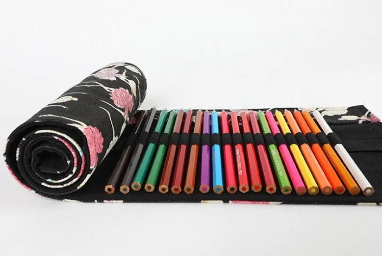 Square canvas rolling pencil case with ballet girl print, showing multiple holes for pencils.