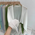 Women's hollow thin loose blouse with lantern sleeves in apricot colour showing slim fit and hollow-out detailing