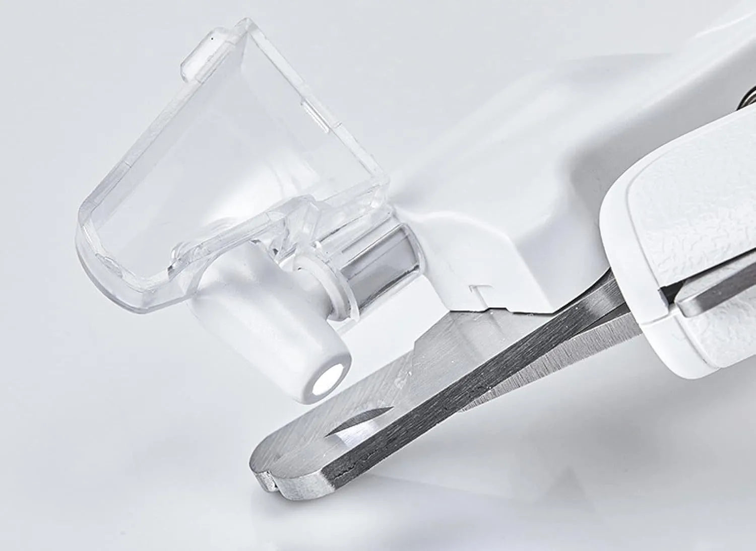 White pet nail clipper with LED light on handle and transparent anti-splash guard surrounding the blades.