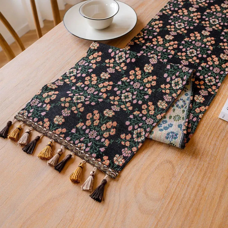 Nordic striped jacquard table runner with tassel trim in dark blue colour.