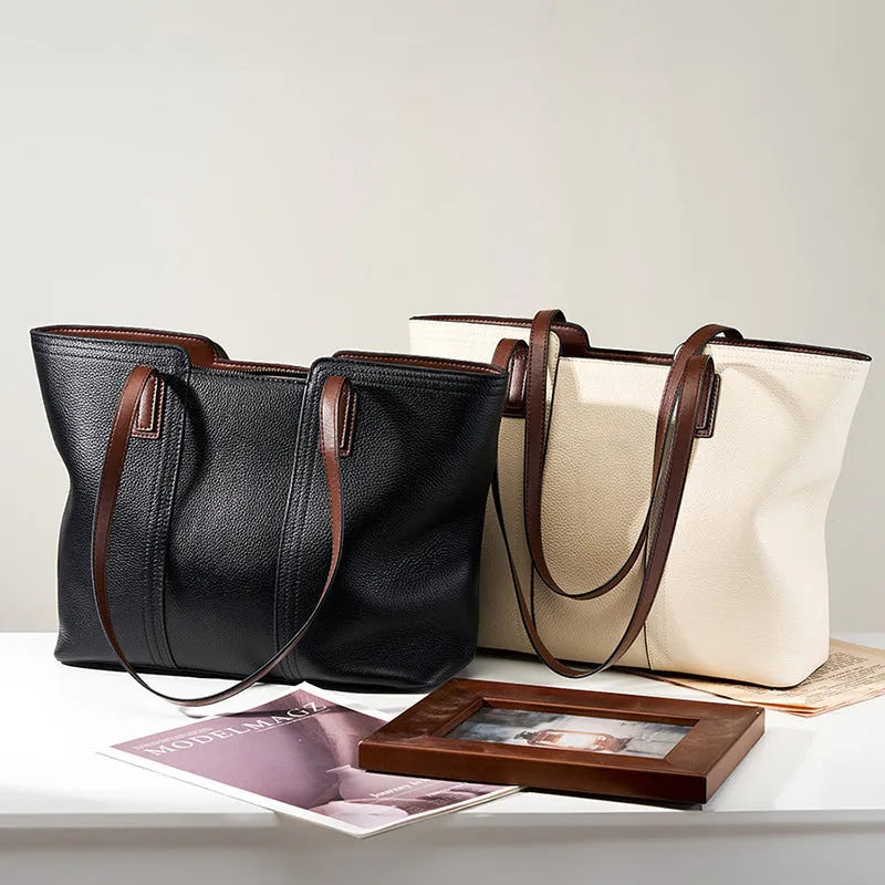 Women's black genuine leather crossbody shoulder bag with multiple internal compartments and a single strap