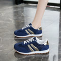 Blue women's casual sports trainers with cross shoulder straps and a white non-slip rubber sole.