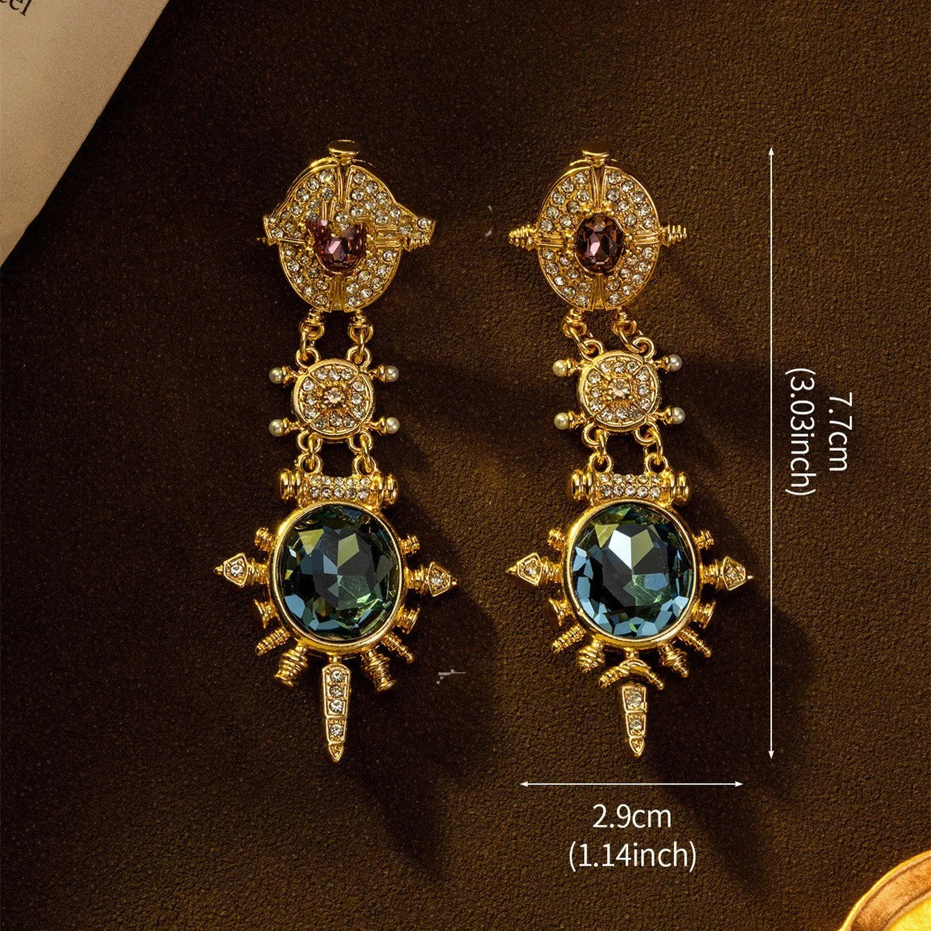 Geometric gold coloured retro stud earrings with round design elements on alloy stud backs