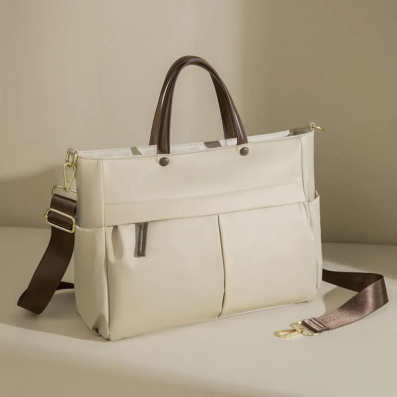 Women's Oxford cloth laptop briefcase in elegant black colour with open pockets and contrast stitching