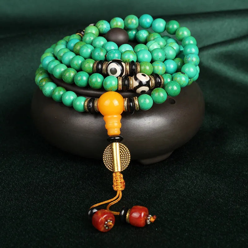 Natural turquoise gemstone bracelet with 108 round 8mm polished beads.