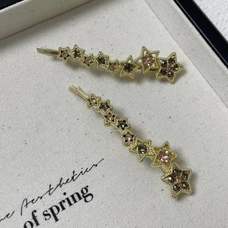 Gold electroplated rhinestone barrette with star design hair clip