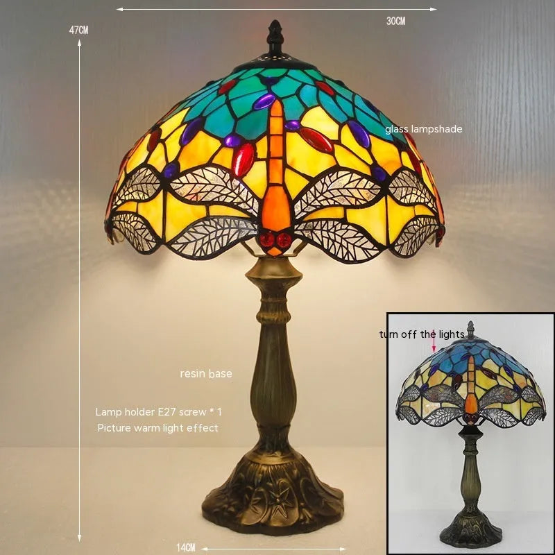 Stone table lamp with Tiffany-style blue dragonfly design on base