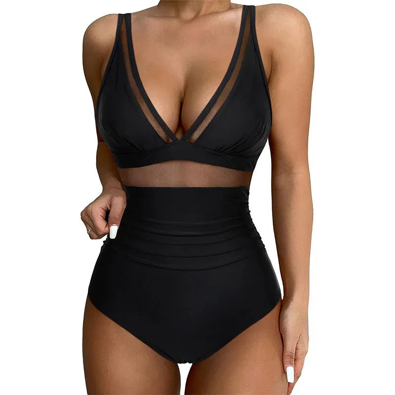 Black women's one-piece halter swimsuit with mesh detailing and attached briefs, shown on a size chart.