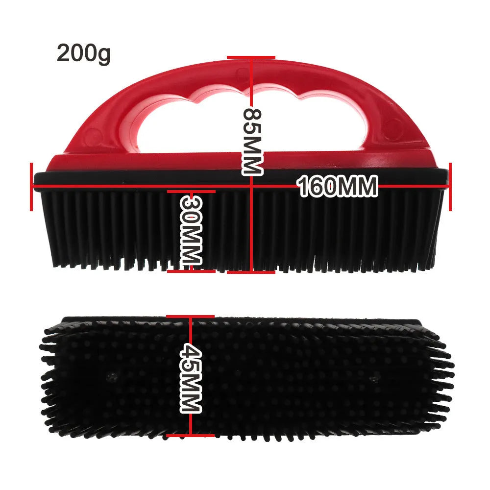 Red pet hair removal brush with silicone bristles and ergonomic handle on a white background.