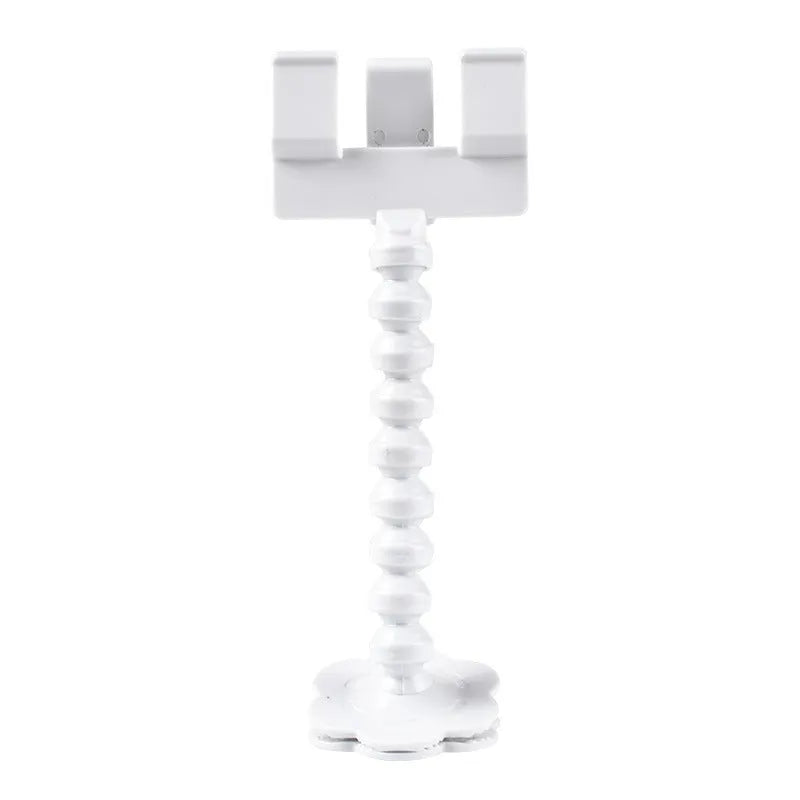 Black plastic pet photography tool with treat clip and phone holder, shown rotated to adjust angle.