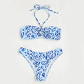 Women's blue floral bandeau bikini with split design and backless styling for swimming