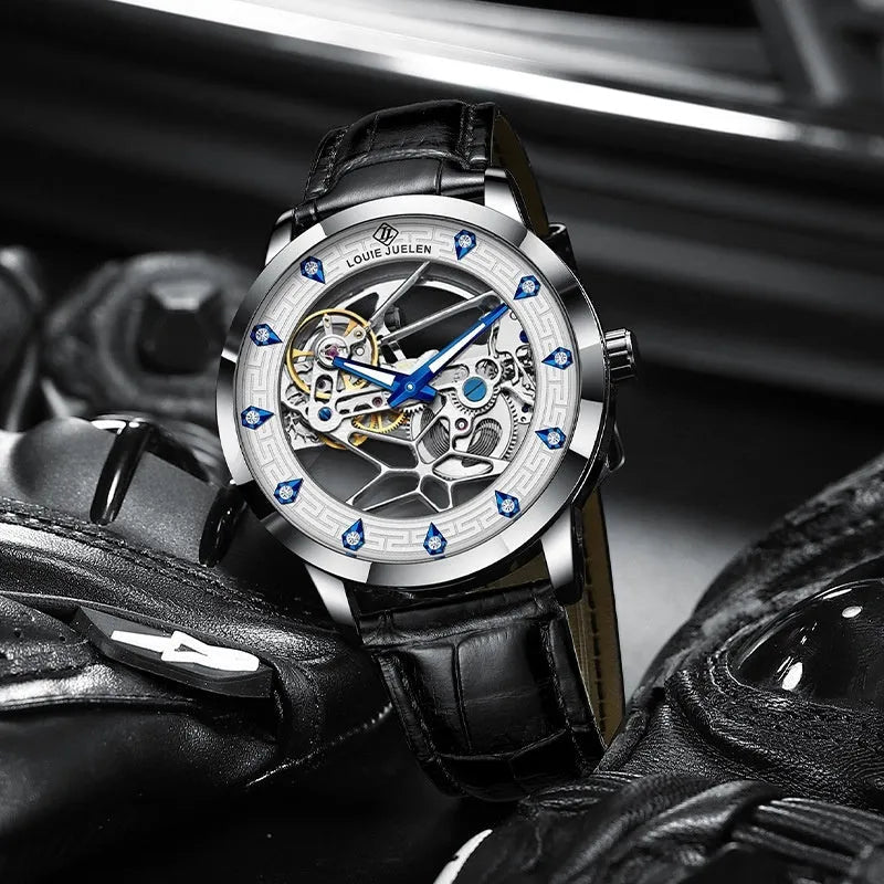 Men's silver mechanical watch with black leather strap, white dial, blue hands, and butterfly buckle