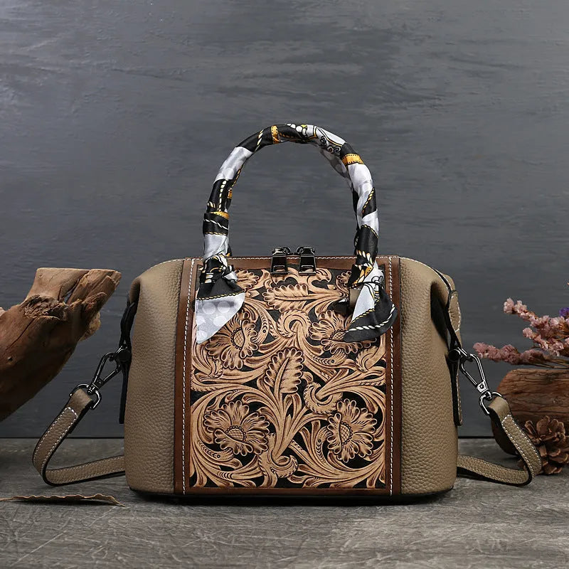 Vintage-style genuine leather messenger bag in black, showing internal zipper and phone pockets.