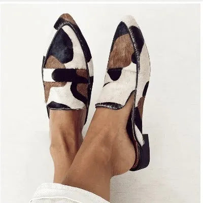 Women's black and white apricot retro pointed-toe shoes with imitation horse hair detailing on suede upper