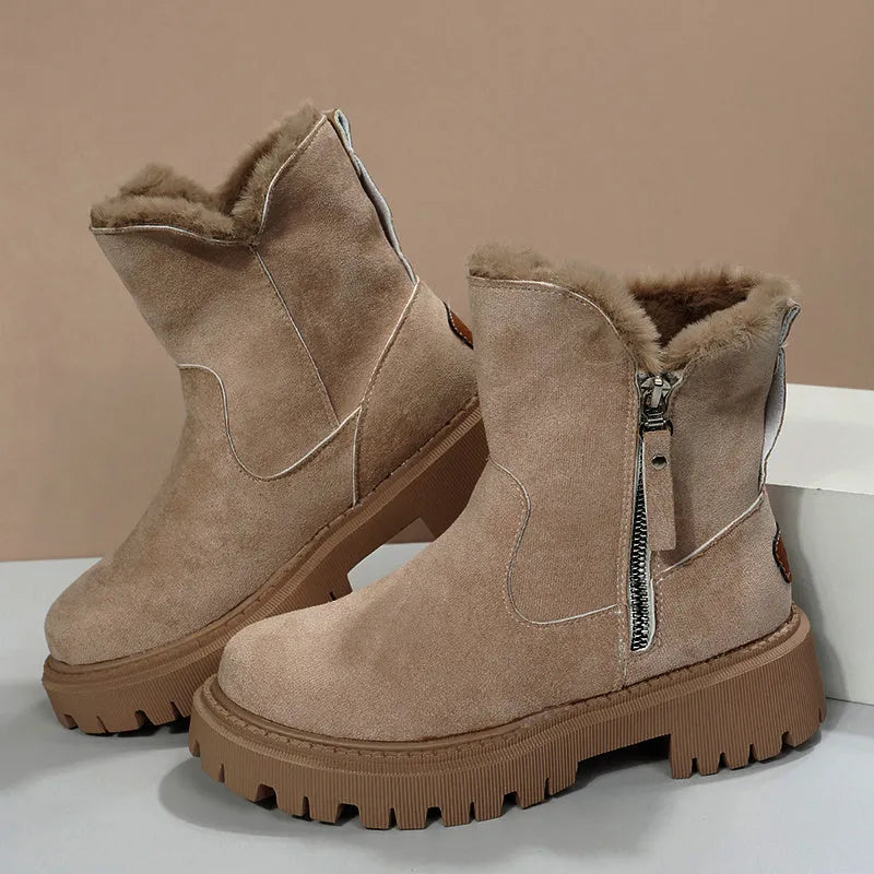 Women's black high-top snow boots with faux suede uppers, side zipper, and fluffy fur lining.