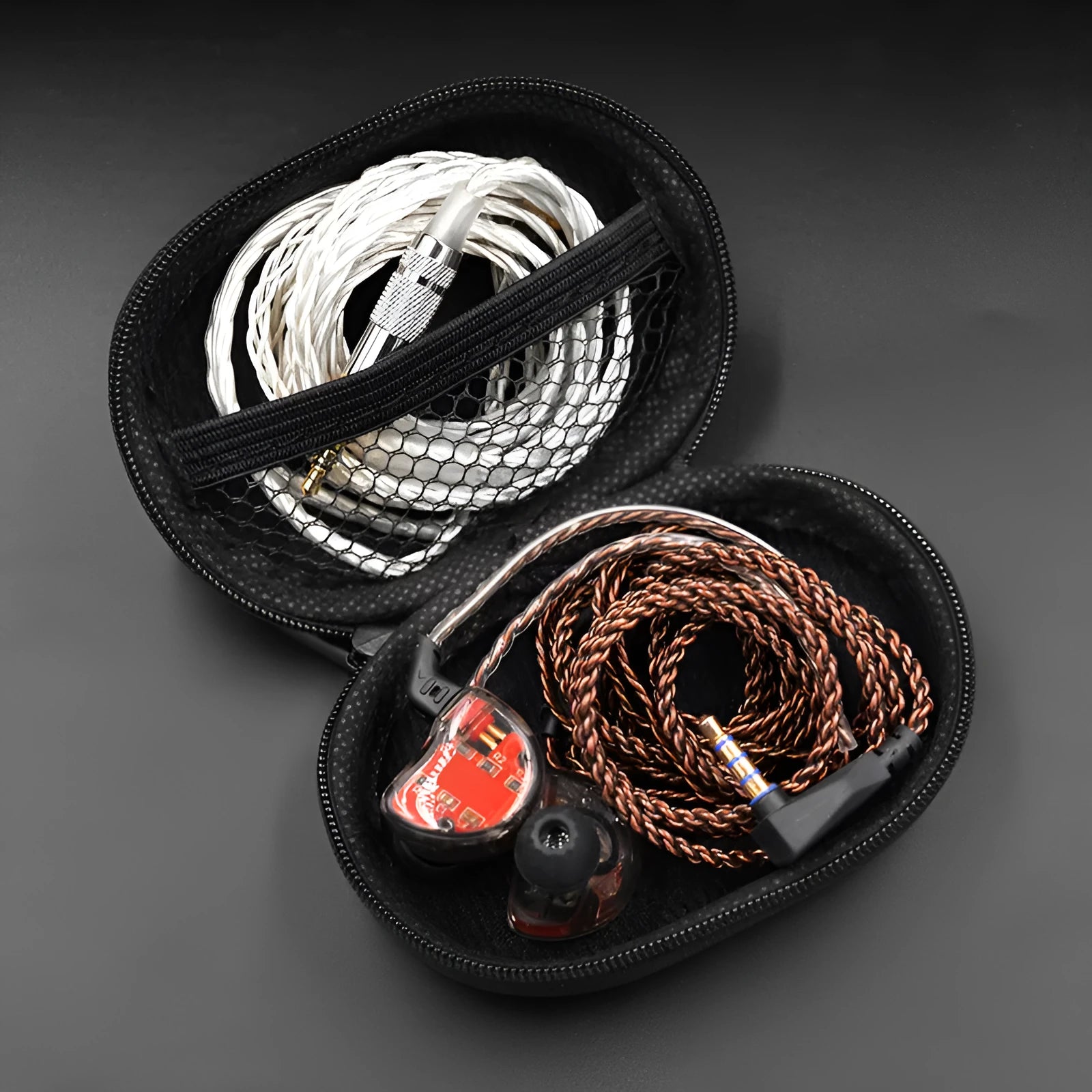 Black oval portable leather storage bag for earphones compatible with EDX PRO and ZEX PRO models