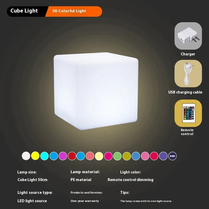 A modern square white LED cube stool light for outdoor garden use.