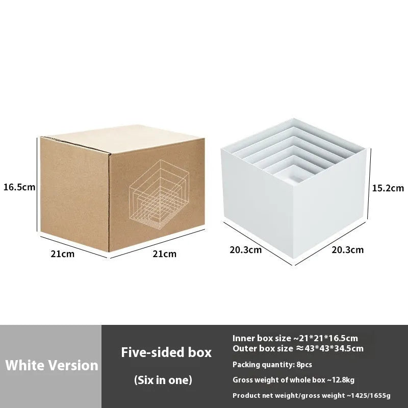 White plastic Suit Cube dessert display stand with six modular pieces arranged in multi-level configuration