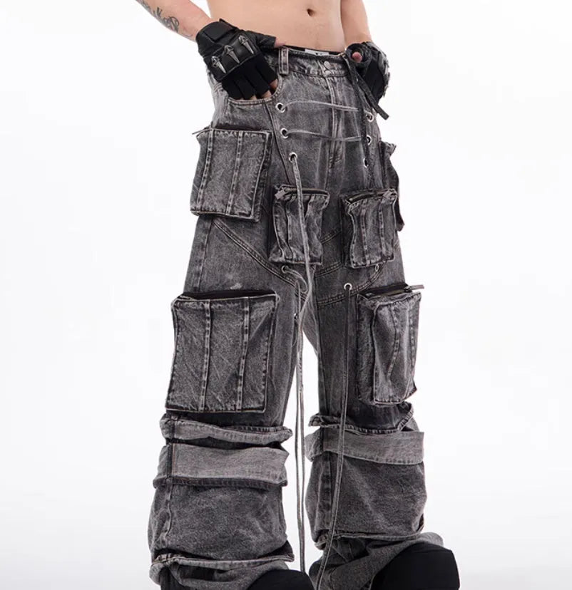 Women's grey distressed denim overalls with mop pant silhouette and rope stitching details