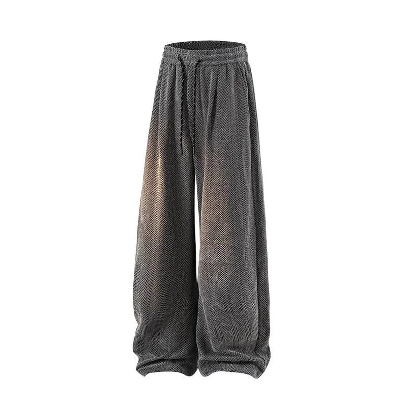 Light grey fleece-lined straight-leg trousers with a hollow-out sports design on a hanger.