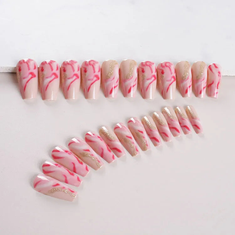 Wearable manicure set with 24 medium nails in rose, tulip, leopard print, and XINGX designs, plus glue.