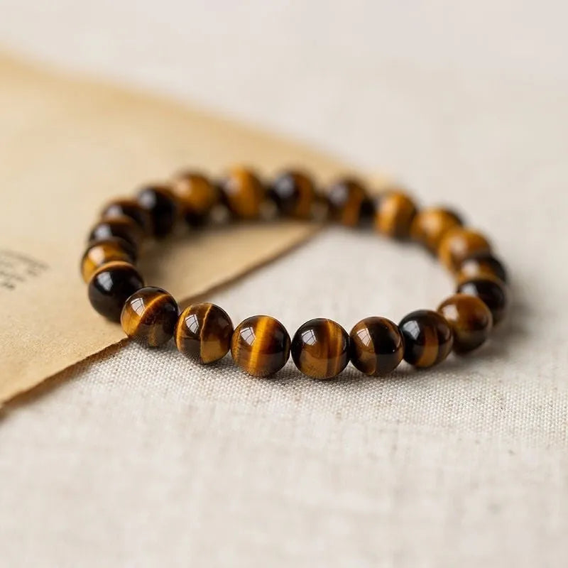 Tigereye stone Buddha bracelet with single circle rosary design showing natural banded patterns on beads