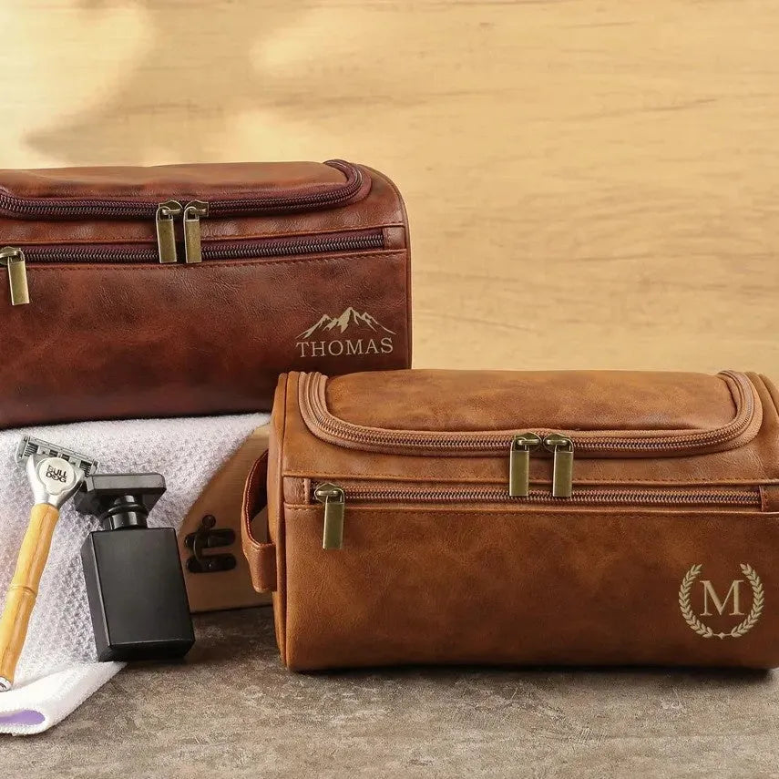 Men's black PU leather travel toiletry bag for grooming storage.