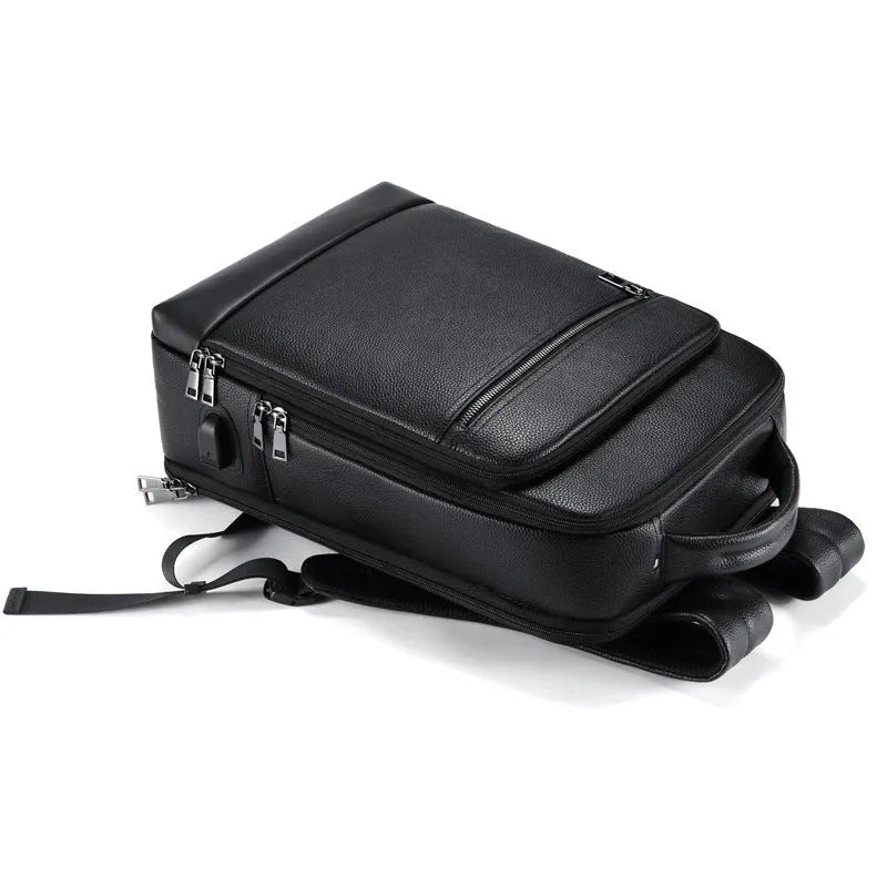Black leather men's business backpack with curved shoulder straps and visible sewing lines
