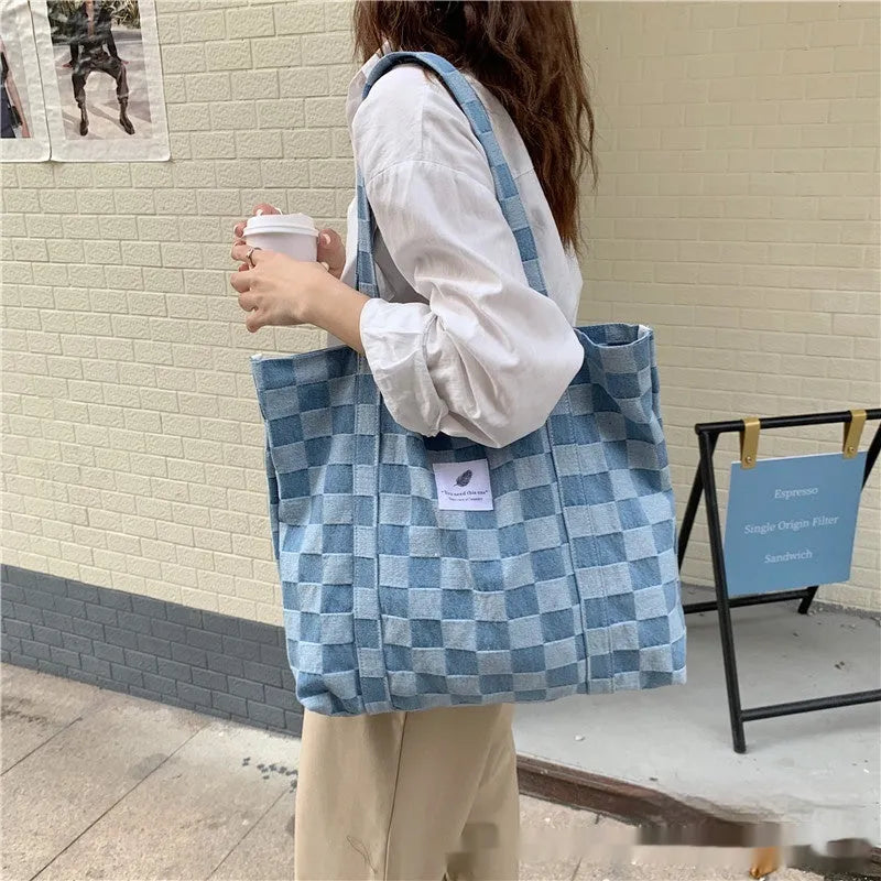 Women's large shoulder bag in oxford cloth with 3D pockets, shown in blue.