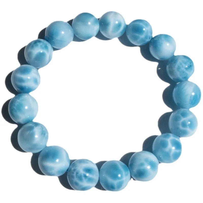 Blue bodhi bracelet with sea-pattern crystal stone and pearl accents in Maillard style.