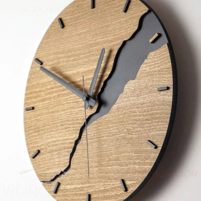 Modern wooden wall clock with a creative crack pattern design on its face, shown in one of five available colour options.