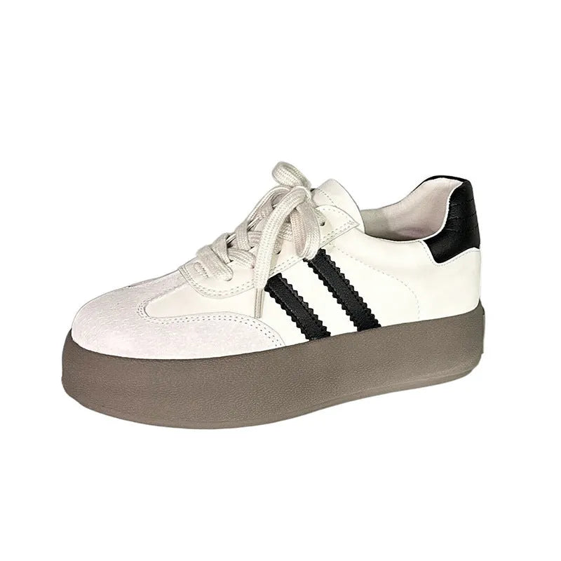 Women's beige vintage distressed cowhide sneakers with round toe and lace-up front.