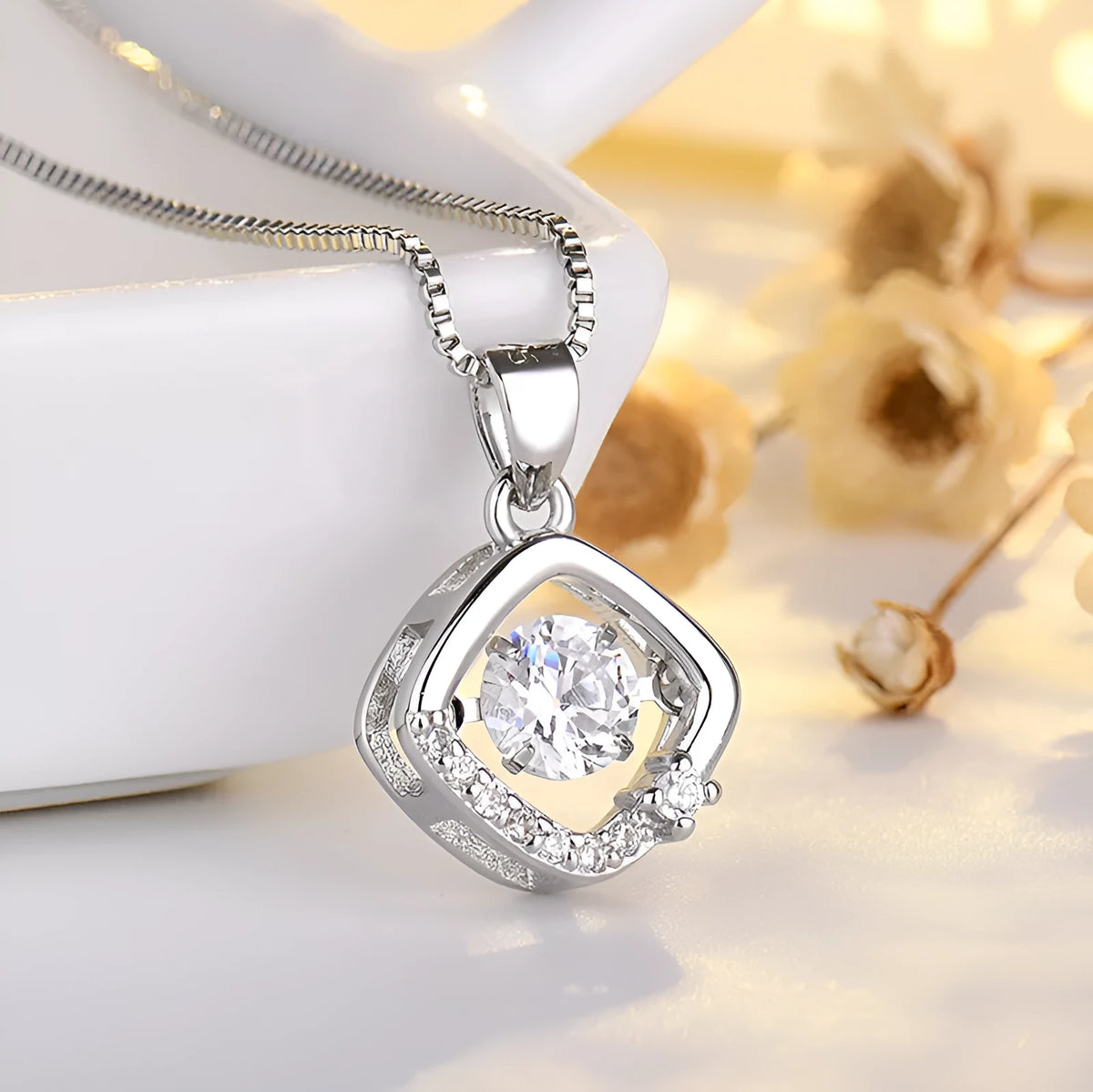 Silver heart necklace with crown and bow details on pendant, adjustable chain